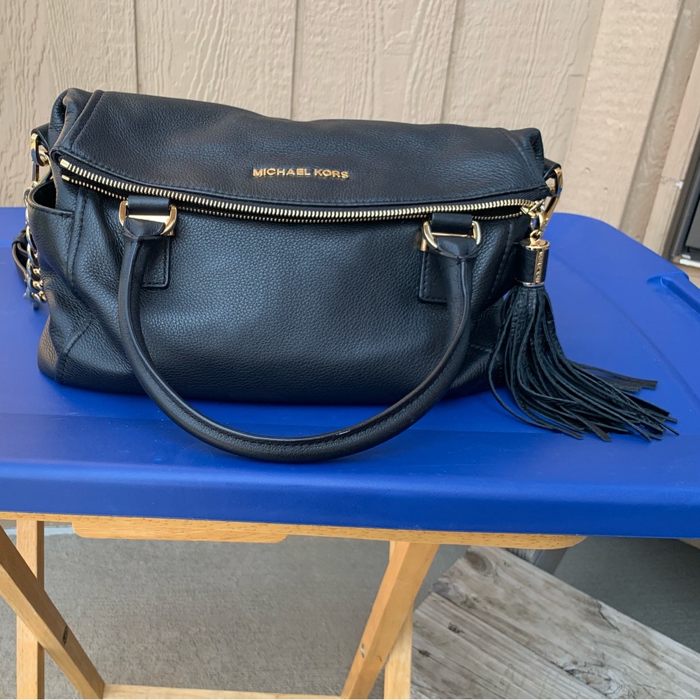 Michael Kors black satchel with tassel.
